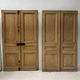 Pair of Haussmann-style double passage doors in patinated oak from the 19th century.