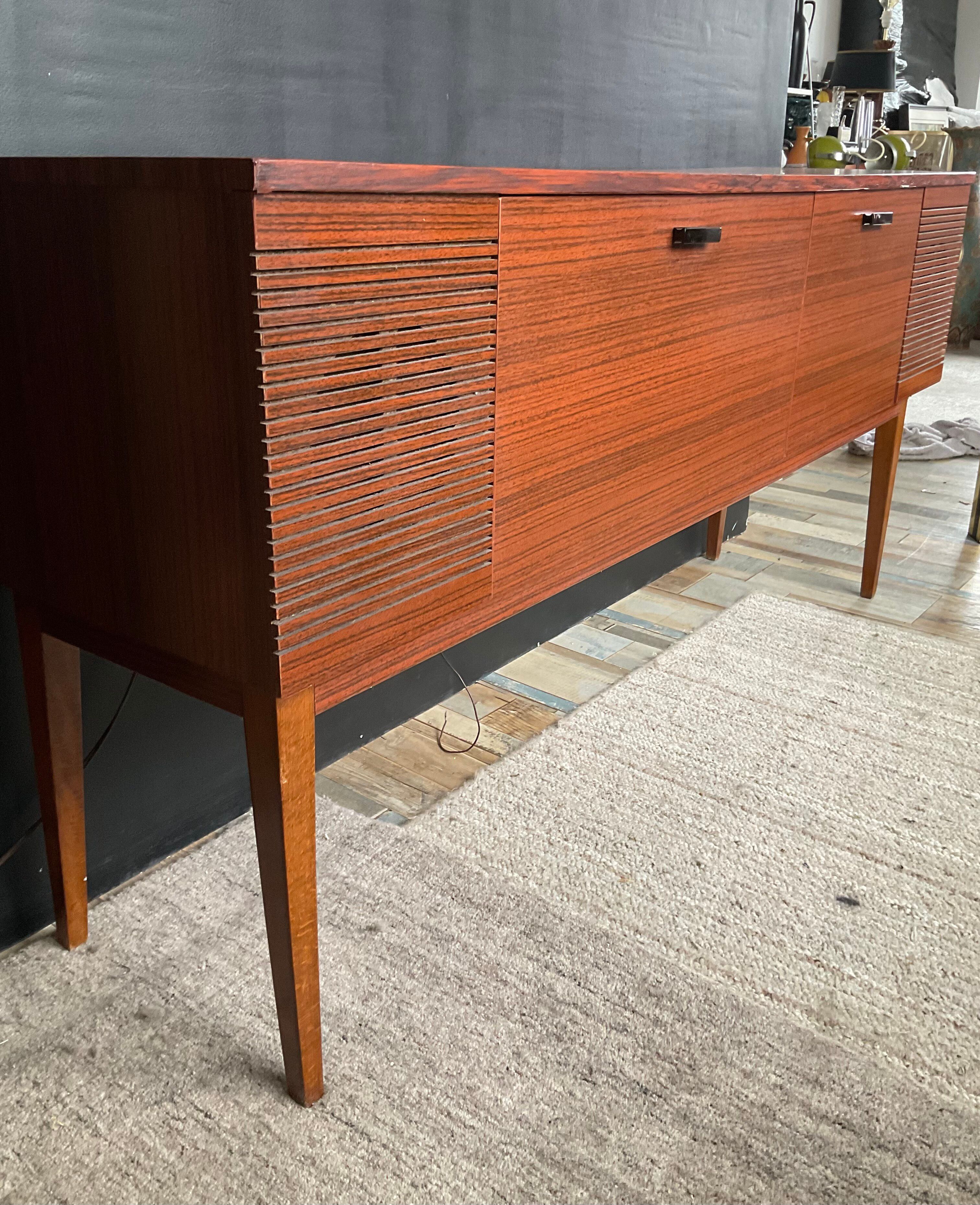Vintage TV sideboard with radio and turntable.