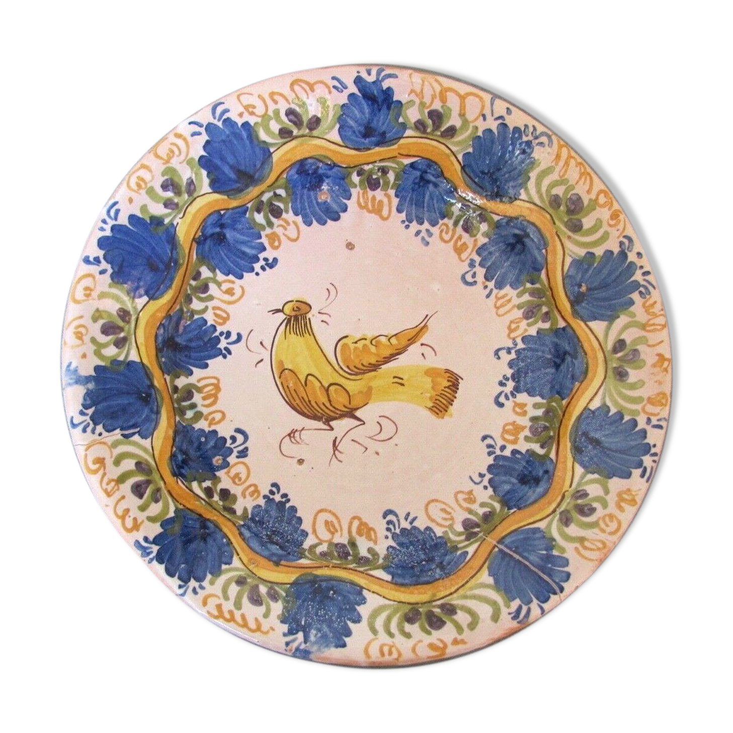 Faience dish decorated with yellow bird on a blue background