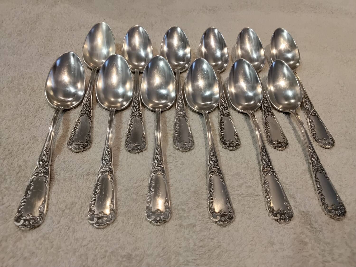 12 silver-plated metal dessert spoons, silversmith SFAM, rocaille design, 19.1 cm.