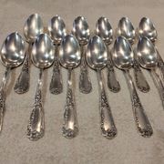 12 silver-plated metal dessert spoons, silversmith SFAM, rocaille design, 19.1 cm.