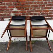 Set of 2 vintage Scandinavian chairs in wood and black faux leather.
