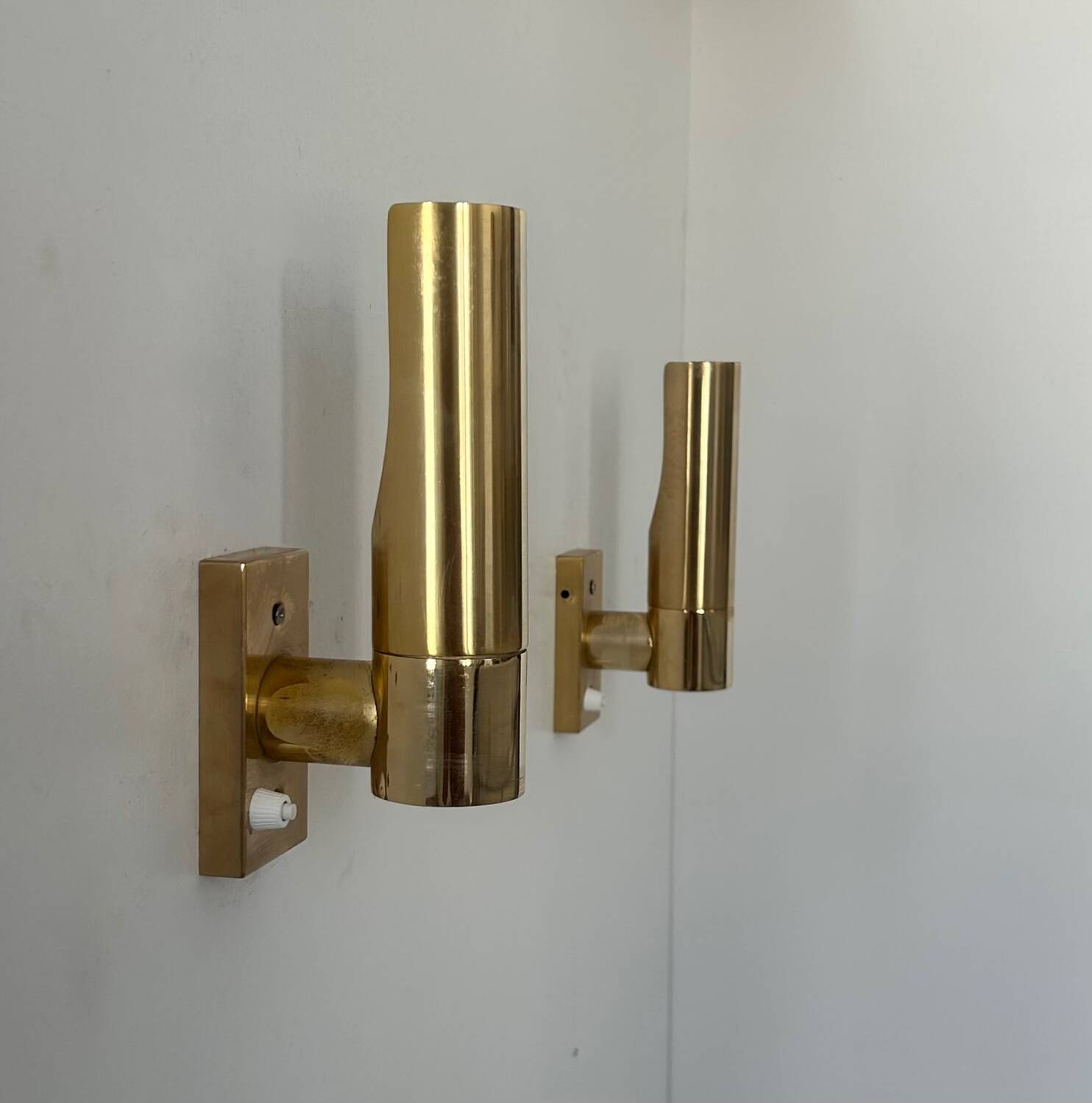 Pair of vintage adjustable brass wall lights, France 1970.
