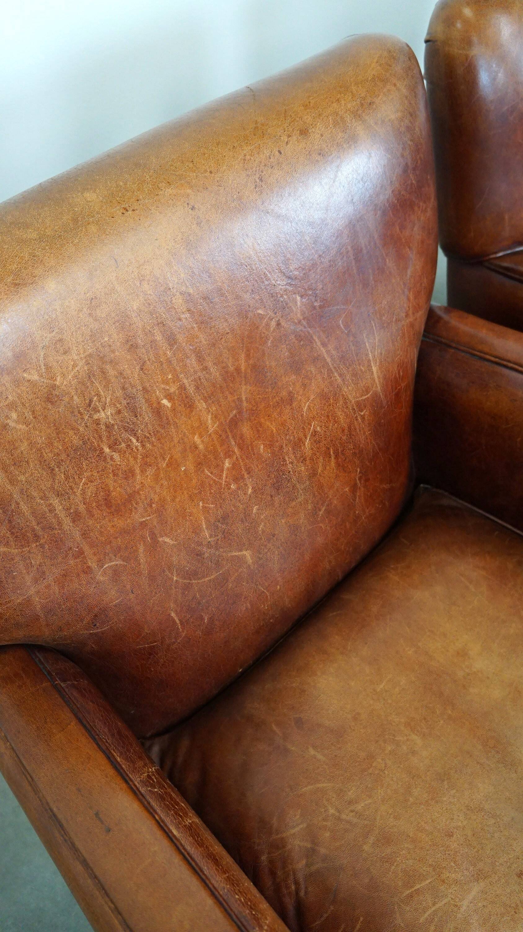 Set of 2 subtle sheepskin leather armchairs with a beautiful warm color scheme