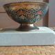 Brass footed bowl with coloured patterns