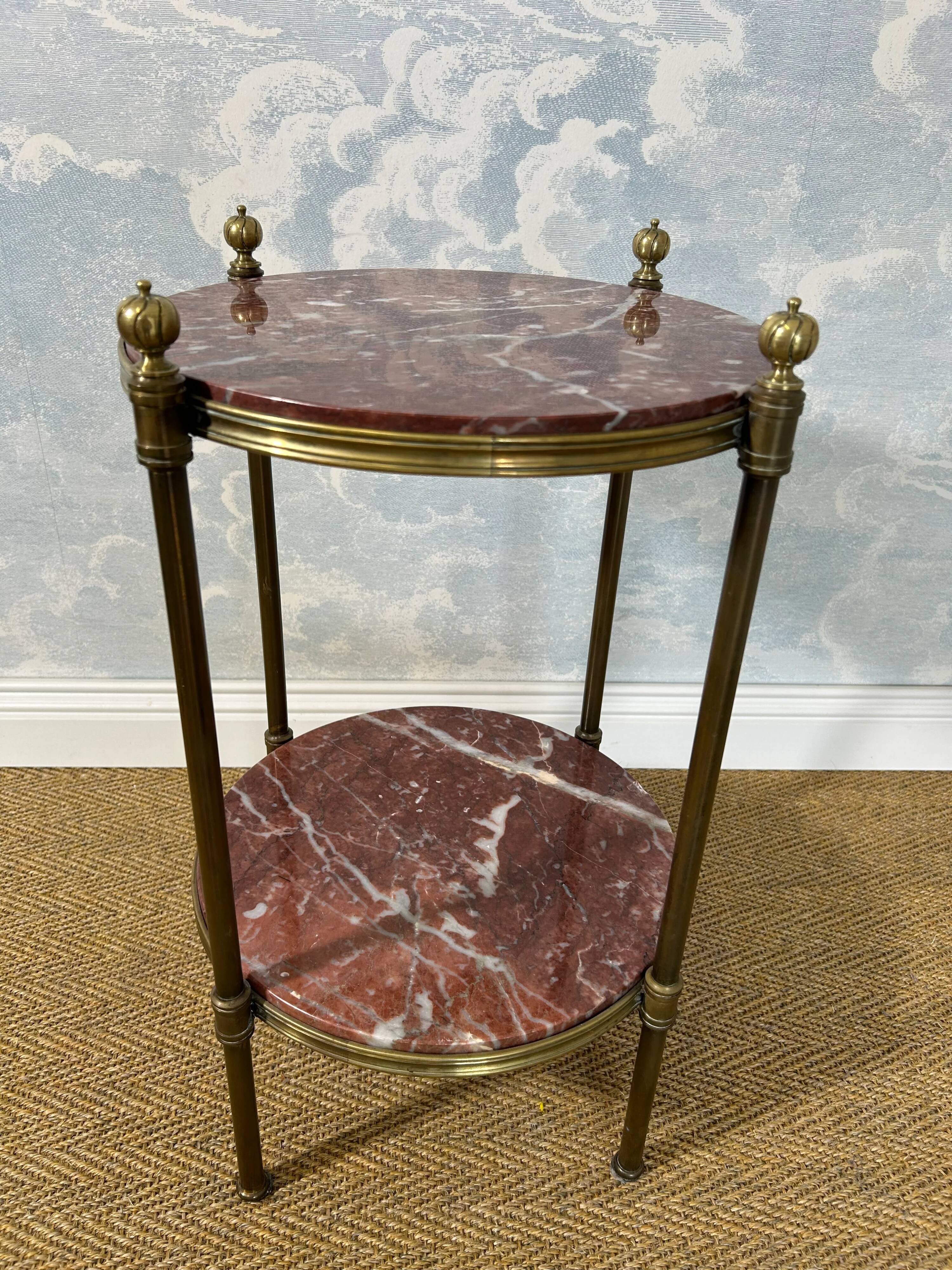 Two-tiered gueridon in Emperador marble on a brass structure, 1970s.