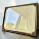 Metal frame in gold colored brass
