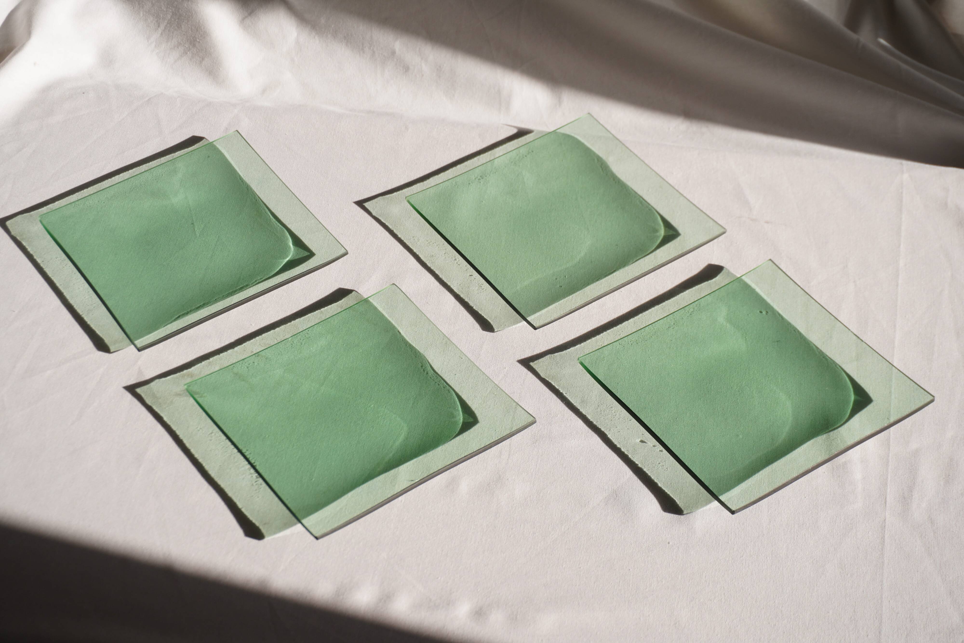 Set of 4 small square green glass plates/bowls