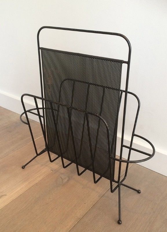 Black lacquered metal and perforated metal magazine rack designed by Mathieu Matégot 50.