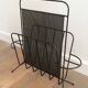 Black lacquered metal and perforated metal magazine rack designed by Mathieu Matégot 50.