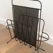 Black lacquered metal and perforated metal magazine rack designed by Mathieu Matégot 50.