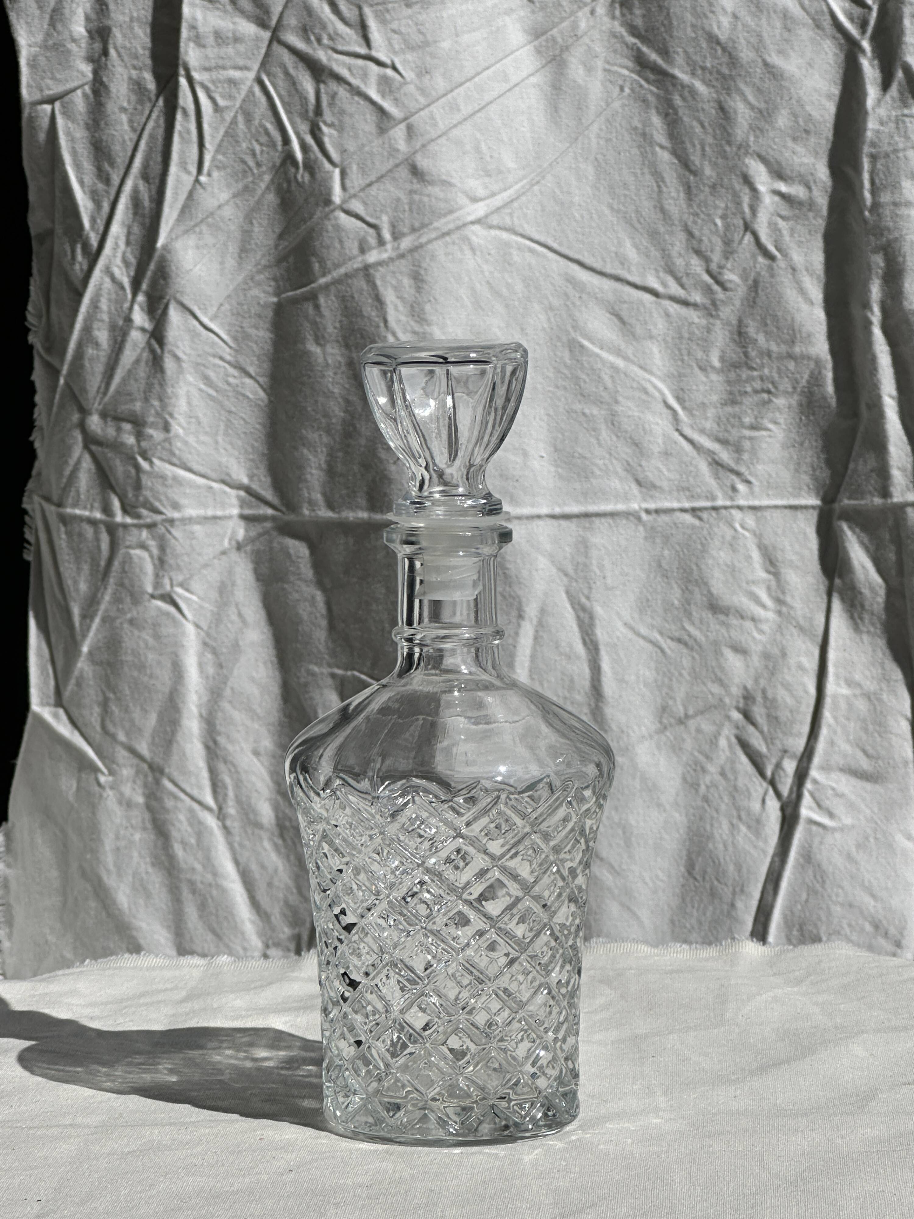 Small cylindrical glass whiskey decanter H:23