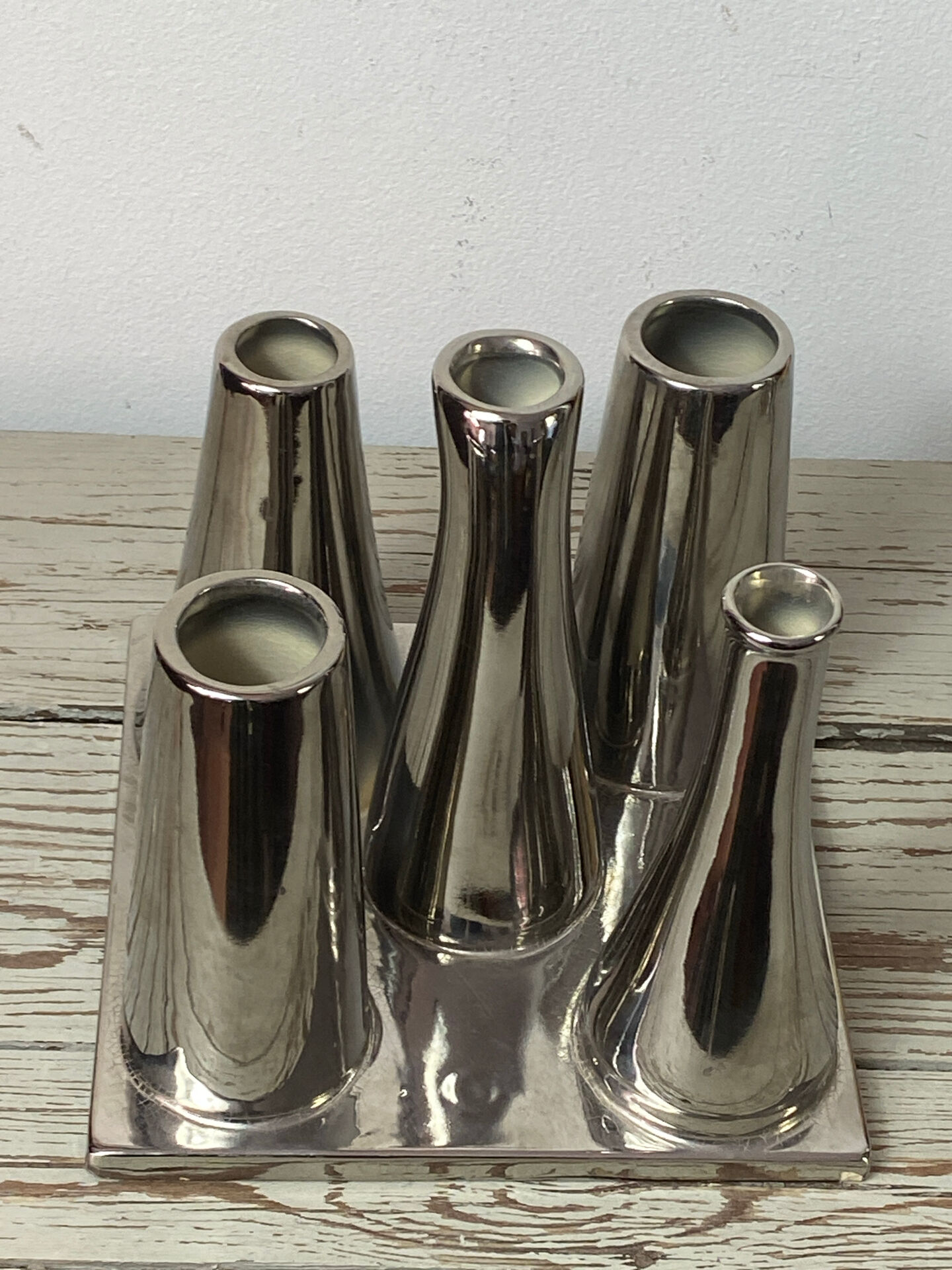 Asymmetrical multitube vase on a base, in silvered ceramic, 1970.