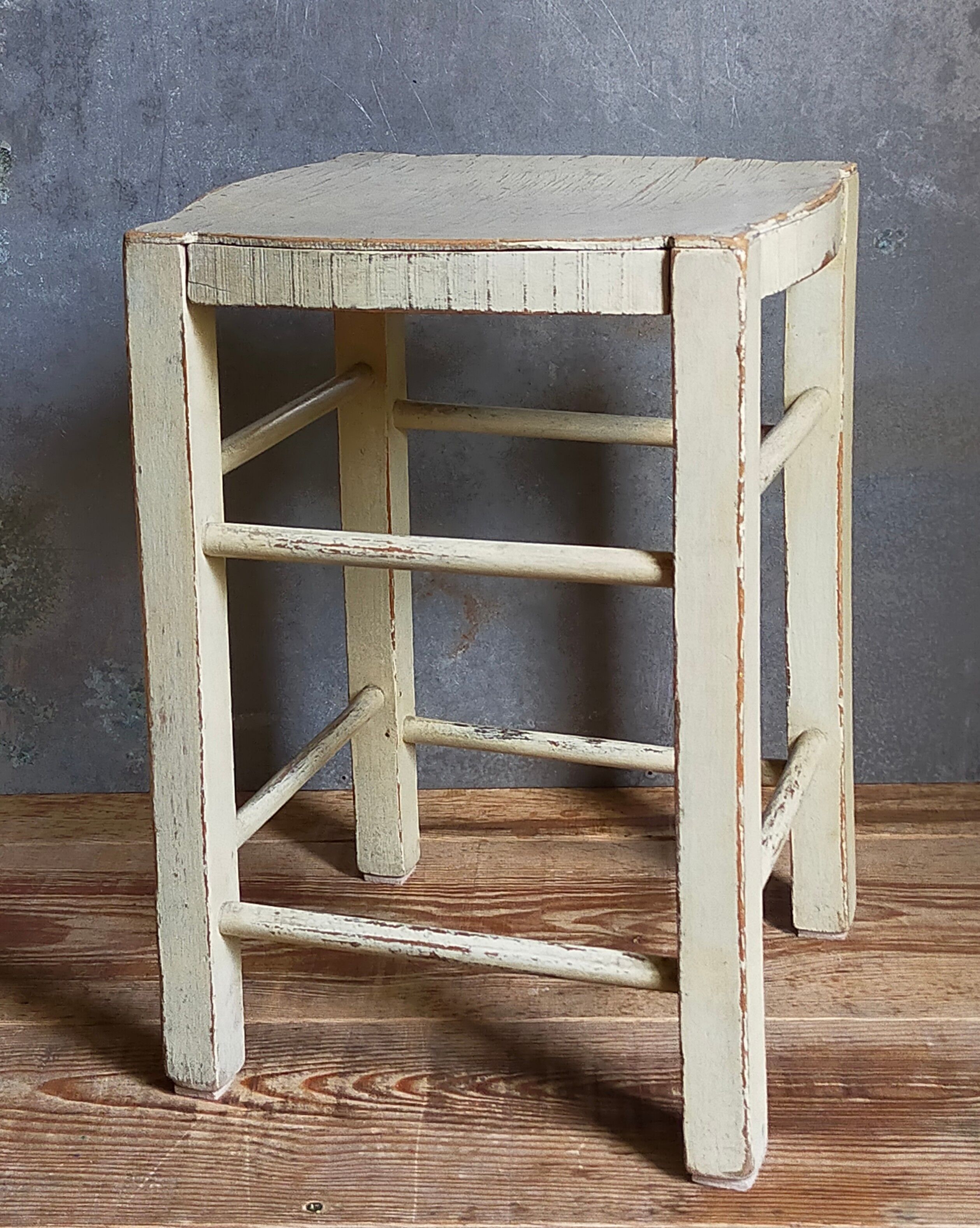 Old patinated painted wooden stool