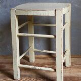Old patinated painted wooden stool