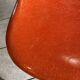 A vintage 70s Eames Herman Miller DSW Fiber Red Orange Dowel Walnut Chair
