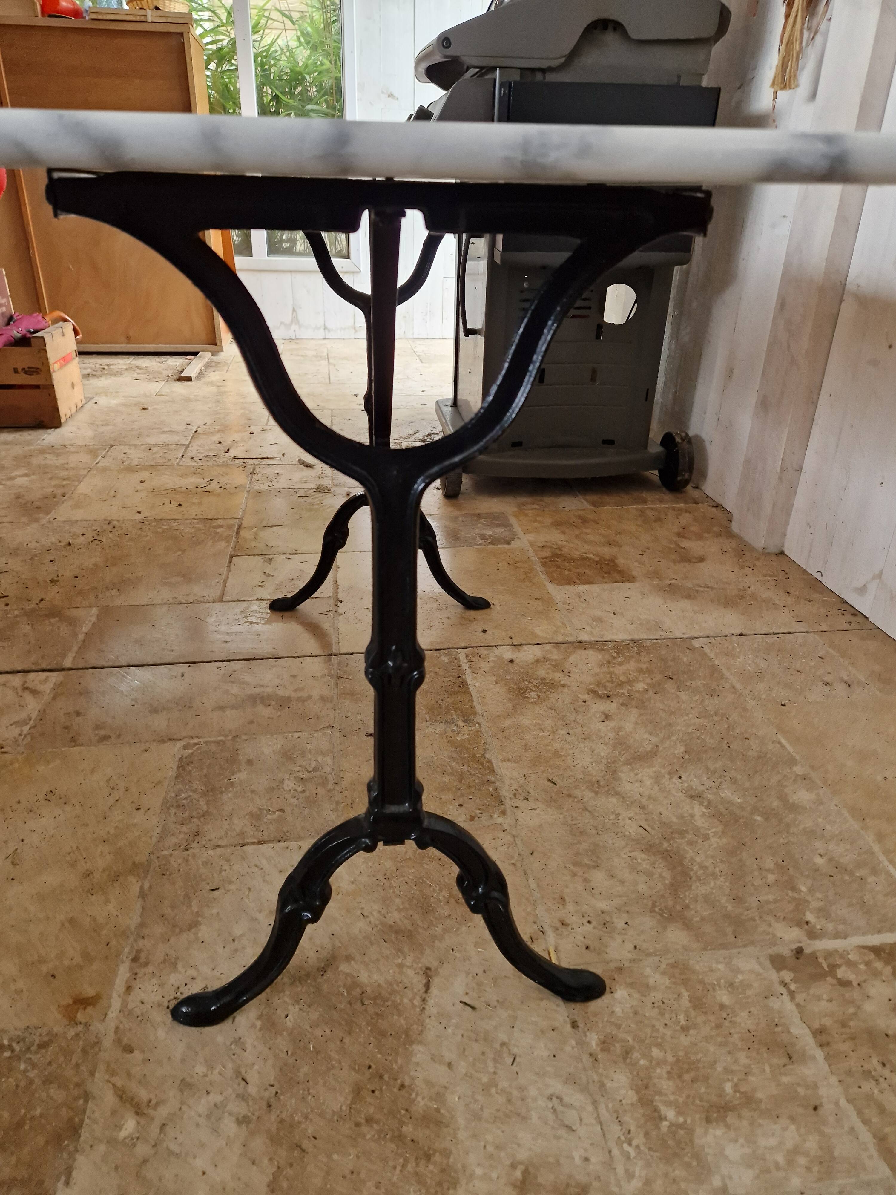 Bistro table with marble top and cast iron legs