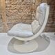 Fauteuil pivotant en cuir patiné gris
