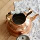 Vintage kettle in copper and ceramic