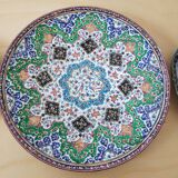 Plate and two decorative saucers enamelled with Persia decoration, circa 1940