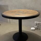 Old bistro round table / workshop – wooden top with metal rim – foot