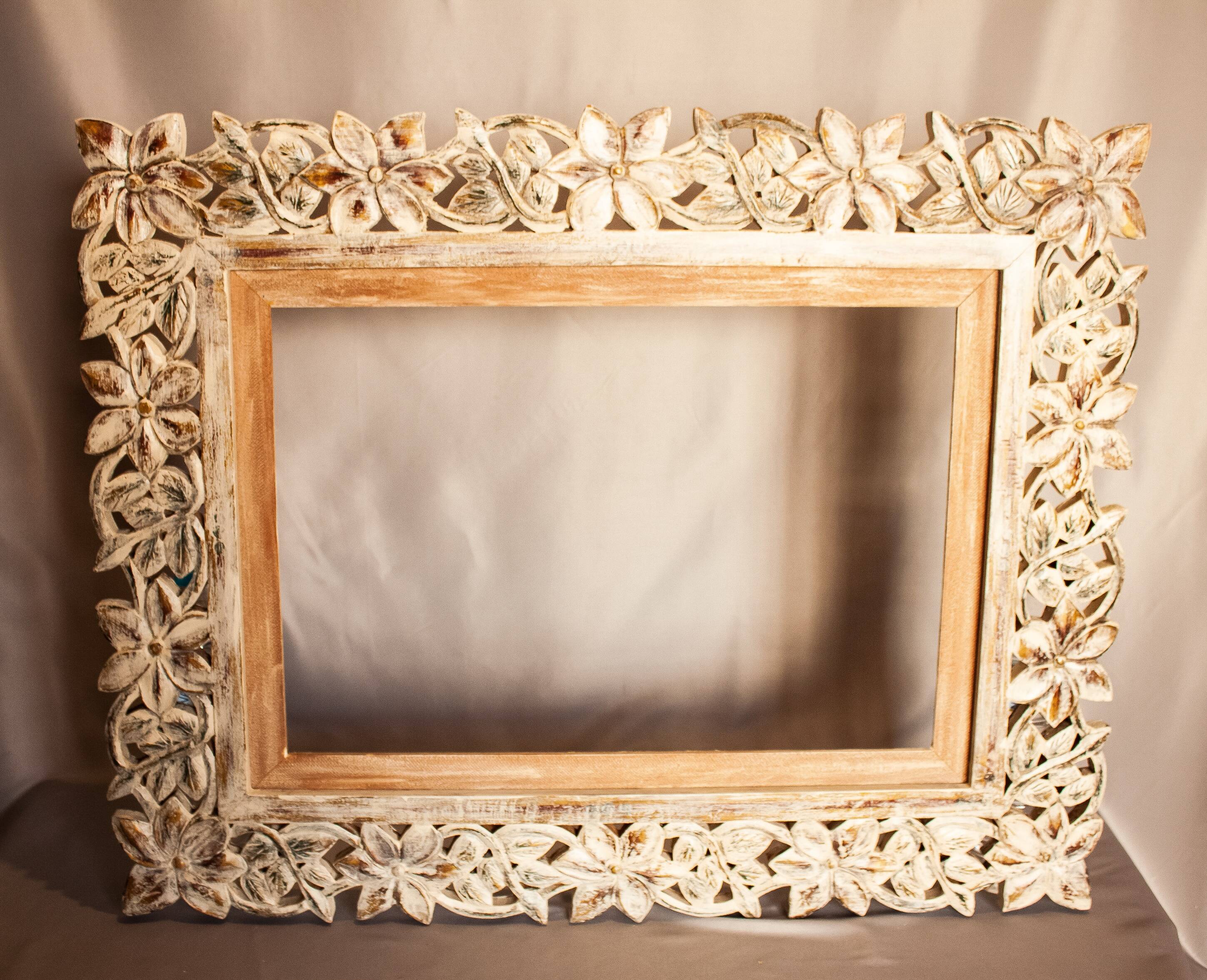 Carved wooden frame. carved wooden frame with floral motifs.