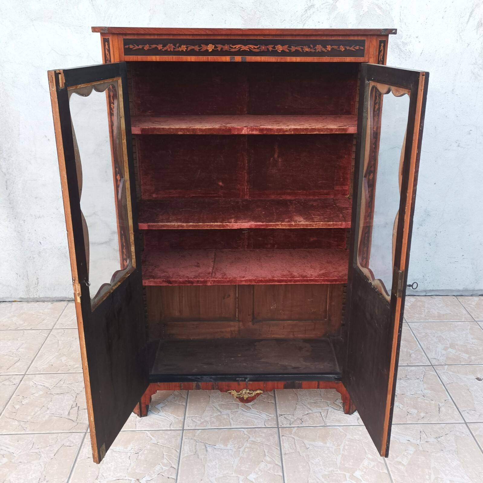 Louis XVI glass-fronted library in rosewood and amaranth veneer.