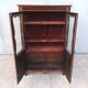 Louis XVI glass-fronted library in rosewood and amaranth veneer.