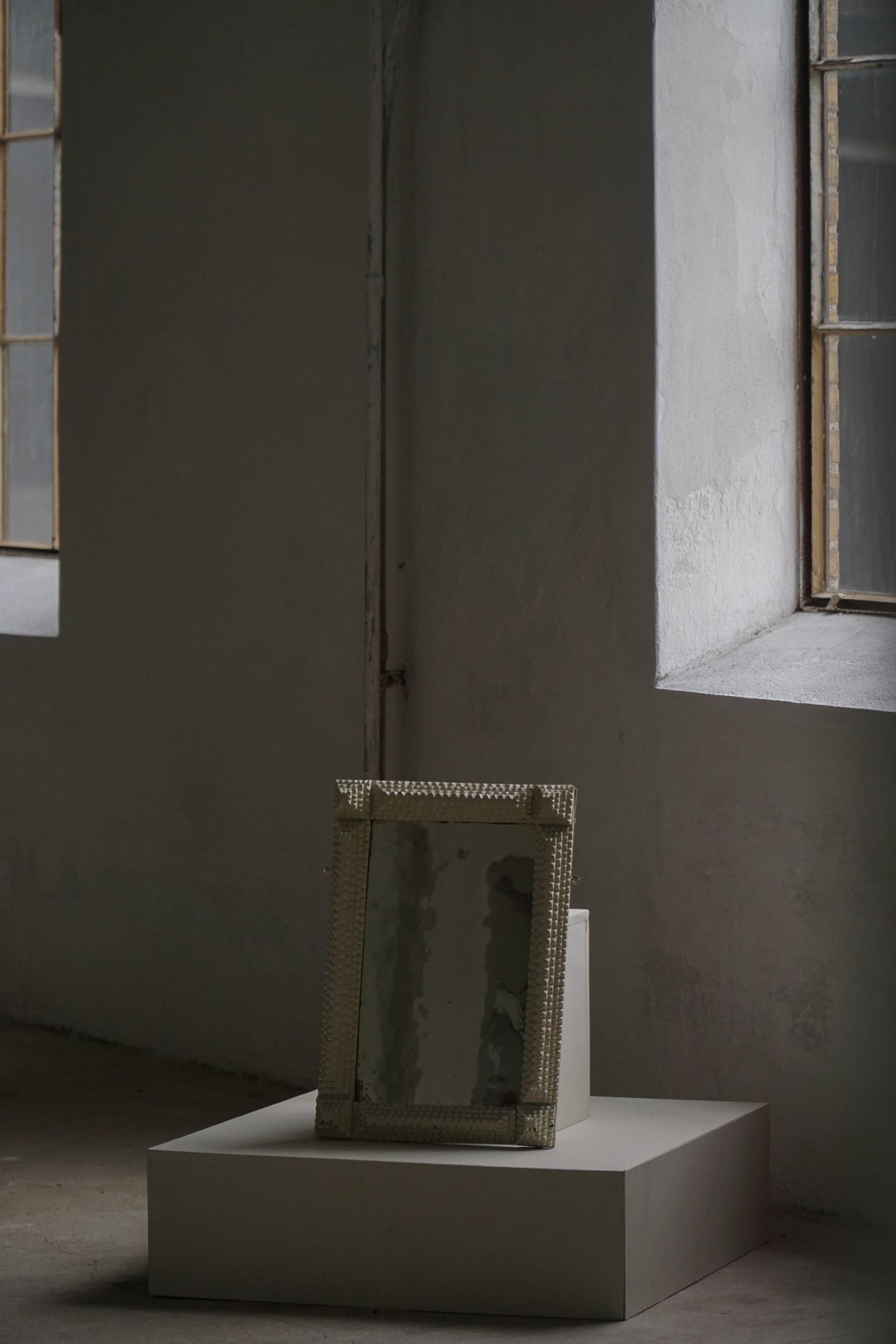 Wall mirror in tramp art style, hand-carved with a painted white frame, early 1900s.