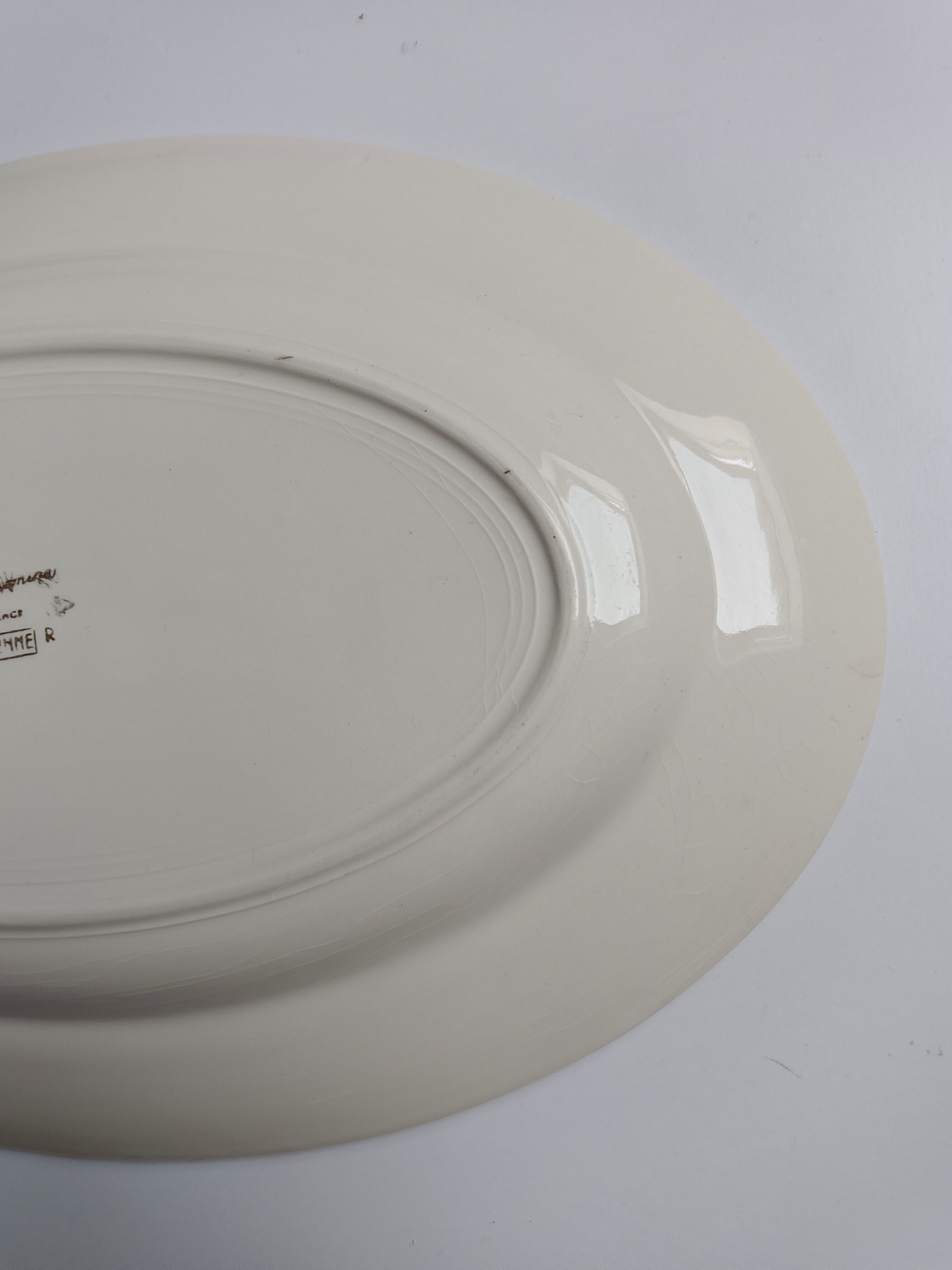 Oval plate Sarreguemines cream with pink gilding, antique.