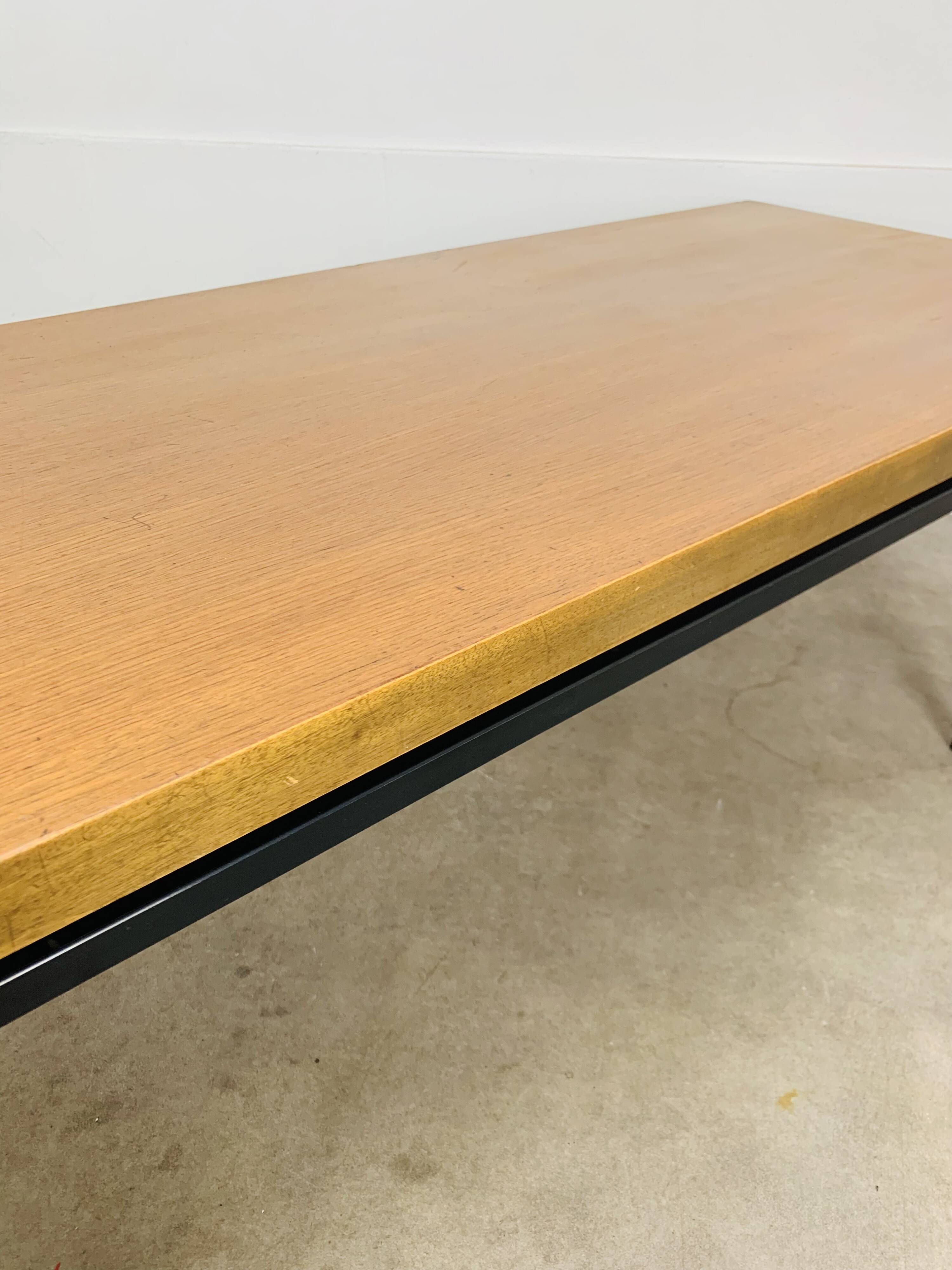 1950s modernist coffee table, wood and black metal.