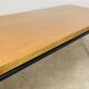 1950s modernist coffee table, wood and black metal.