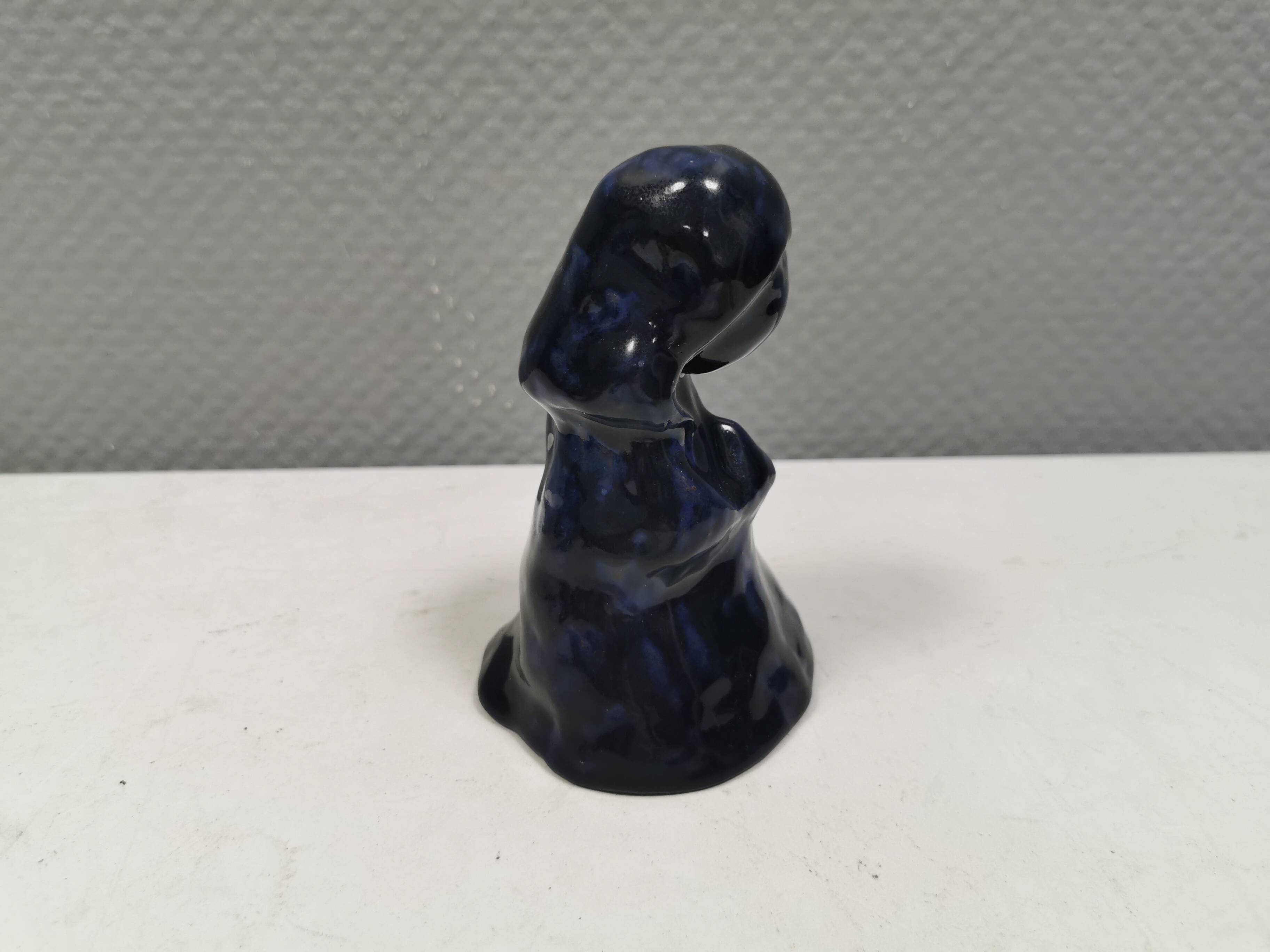 Lady figure in earthenware with shiny blue glaze