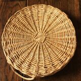 Round wicker tray with two vintage basketwork handles