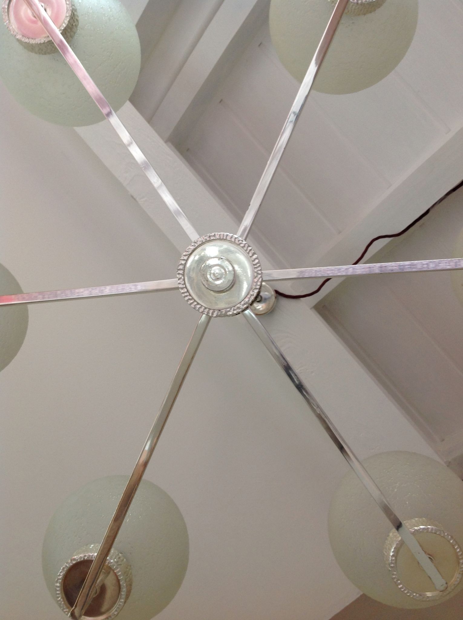 Six-light chrome metal chandelier and opaque glass globes / vintage 60s and 70s