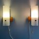 Mid-century wall lights in white plexiglass with a wooden base, 1960s, Germany.