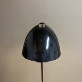 Black metal tripod floor lamp