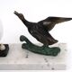 Art Deco lamp decorated with a flying duck, marble base, 1930s.