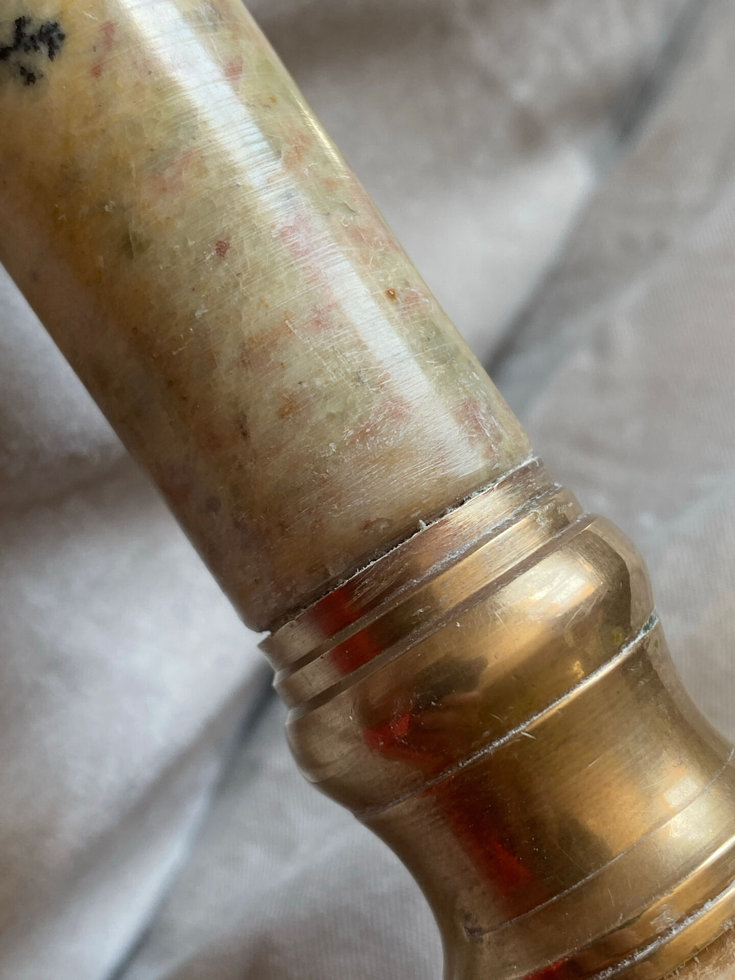 Pair of brass and stone candlesticks