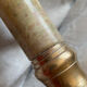 Pair of brass and stone candlesticks