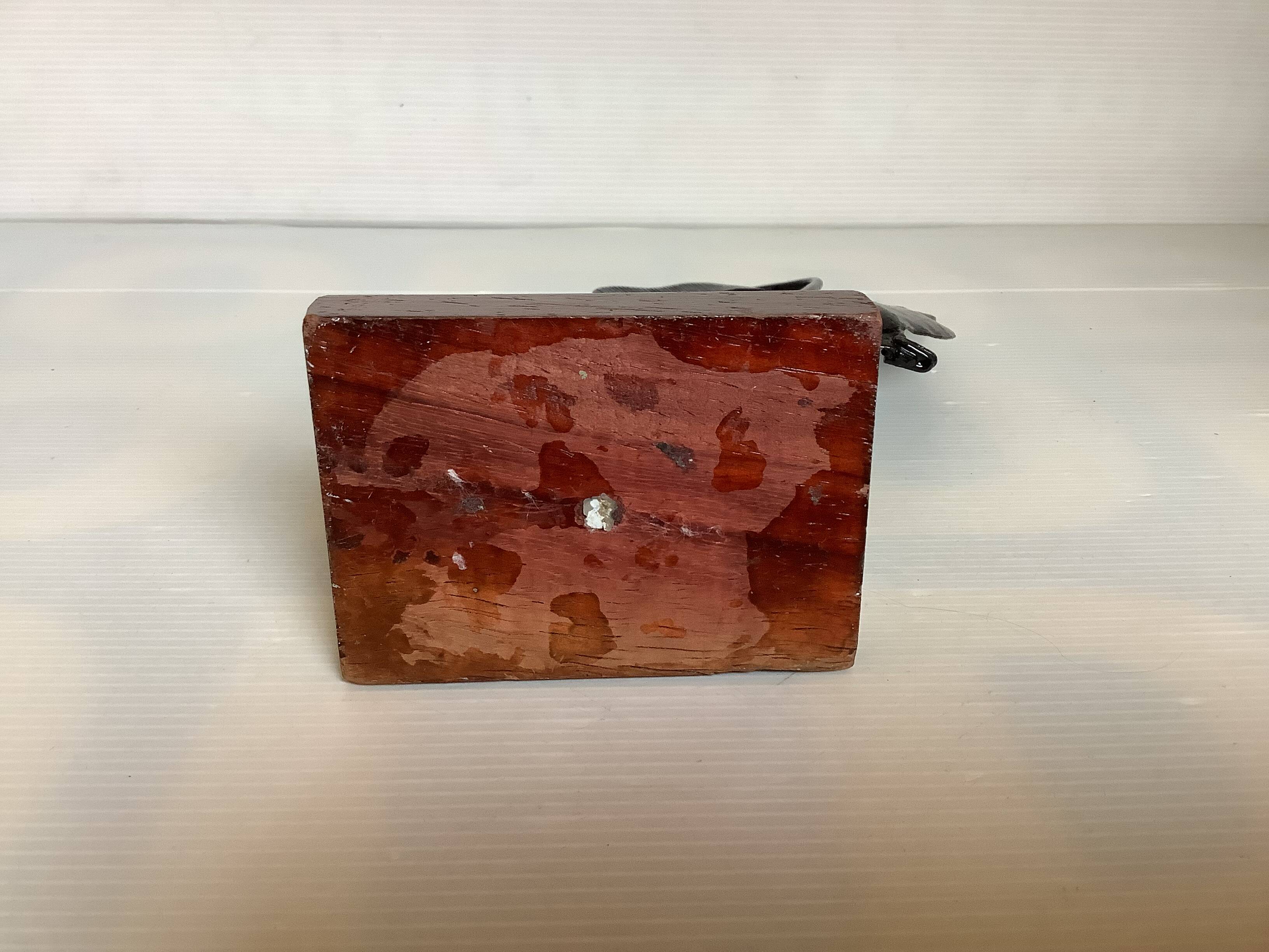 Small metal and wood fish statue