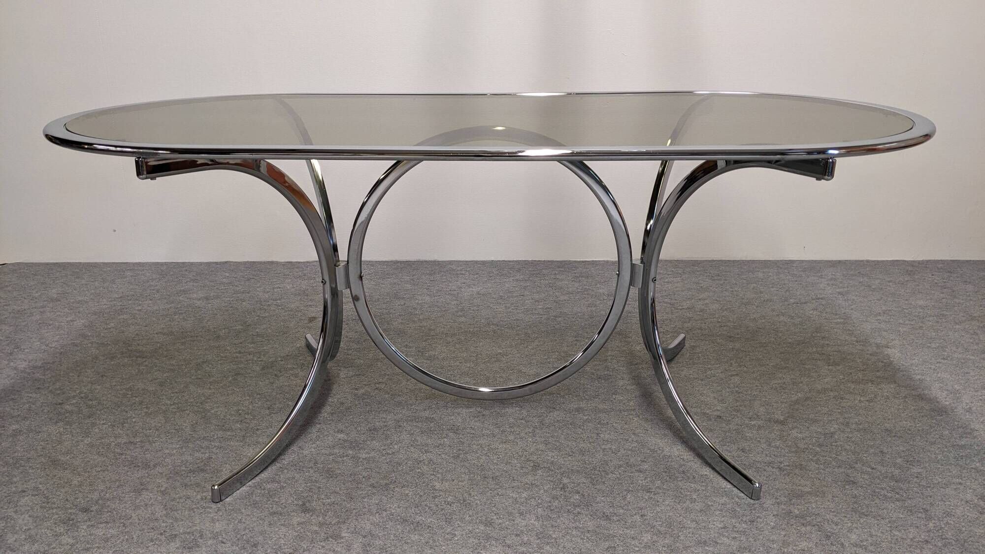 Oval dining table in chromed metal and smoked glass, Italy circa 1970