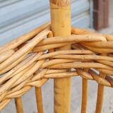 Vintage wicker log basket on vintage wheels