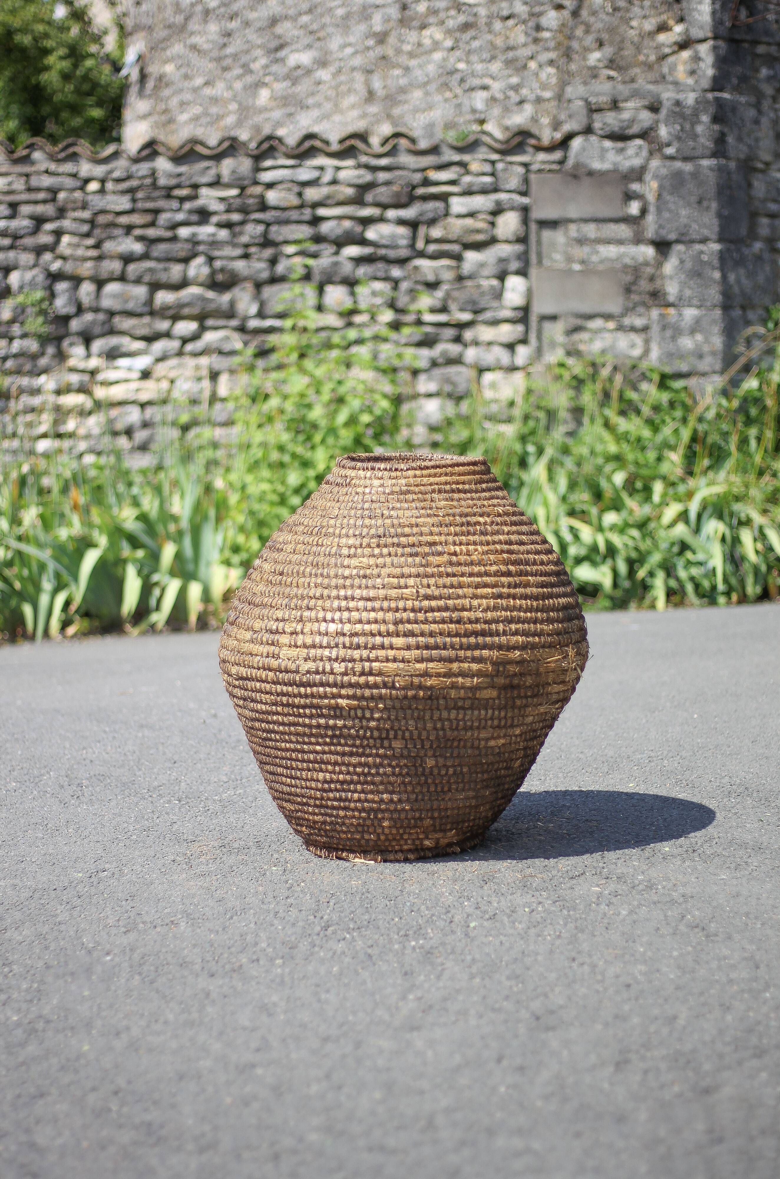 Large old basket, burgundy straw and bramble, woven basket