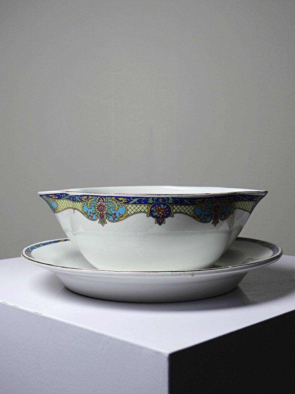 Old Lunéville sauce boat, opaque porcelain with polychrome decoration.