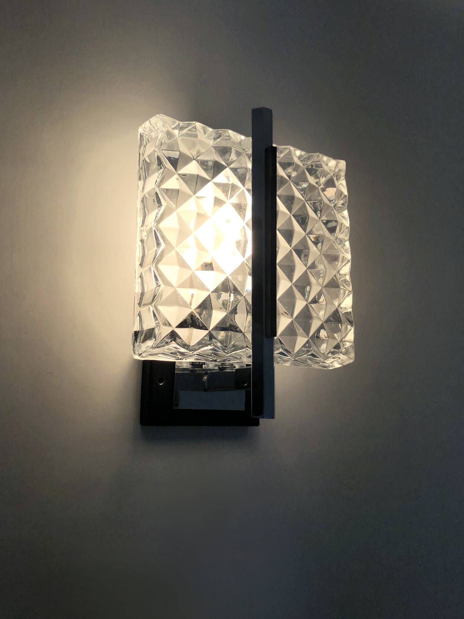 Pair of modernist glass and chrome metal wall sconces. 1960s-70s