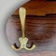 Vintage wall-mounted coat rack in wood and gold-tone aluminum – 1960s