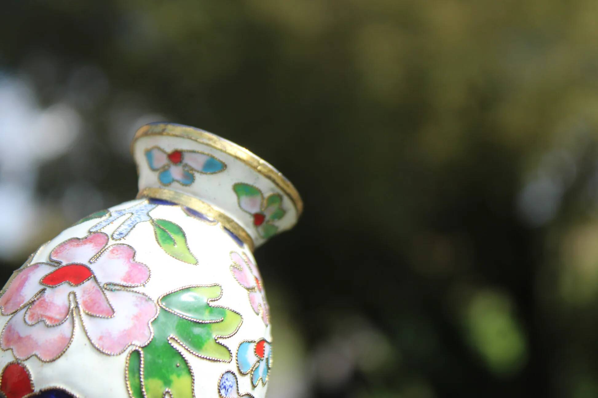 Two small vintage cloisonné enamel vases with Asian floral decoration.
