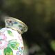 Two small vintage cloisonné enamel vases with Asian floral decoration.