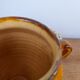 Old glazed terracotta grease pot